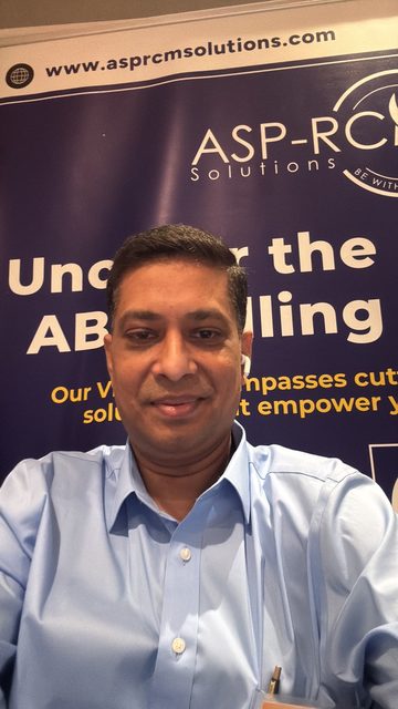 At the ASP-RCM booth backdrop, CASP Leadership Summit 2026, photo 16 of 19