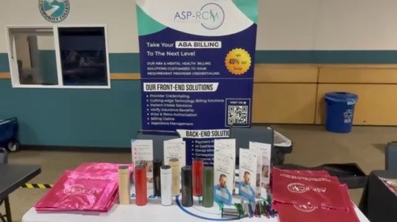 ASP-RCM table display with tumblers and totes, TxABA El Paso 2026, photo 11 of 16