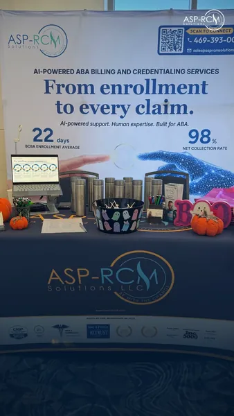 The ASP-RCM booth table with the From enrollment to every claim banner, SC ABA 2026, photo 2 of 7