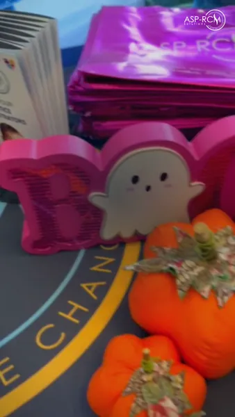 Ghost and pumpkin decorations next to the ASP-RCM tote bags, SC ABA 2026, photo 6 of 7